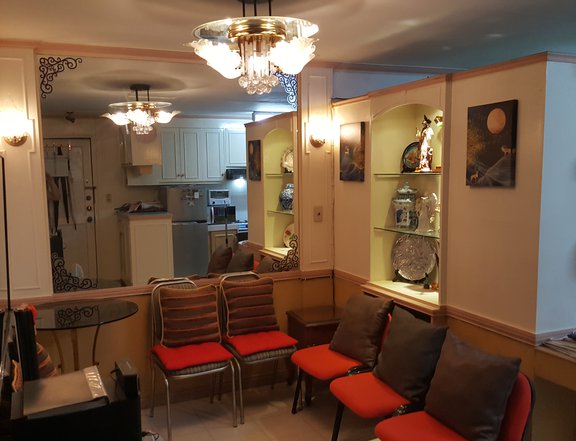 Fully Furnished Condo with parking near malls, MRT, hospitals etc. fully paid clean title paid tax