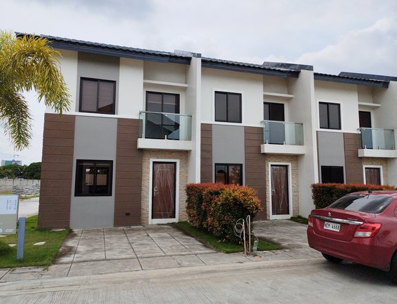 2- storey townhouse with 2 bedrooms, 2 bathrooms, and car port