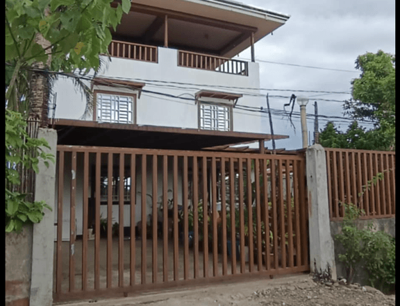 Pre-owned 4 bedroom House with 9 row houses for rent . Big backyard . With water supply.