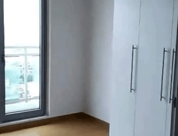 Condo for rent Bare unit 1 bedroom with balcony, water heater, bedet, and cabinet