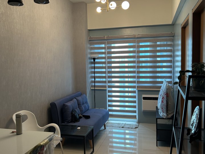 A brand-new fully-furnished 1-bdrm unit with parking