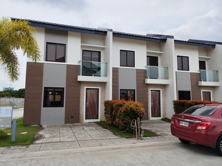 2- storey townhouse with 2 bedrooms, 2 bathrooms, and car port