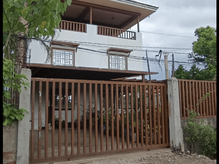 Pre-owned 4 bedroom House with 9 row houses for rent . Big backyard . With water supply.