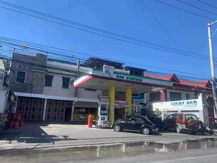 Commercial Building with House and Gas Station