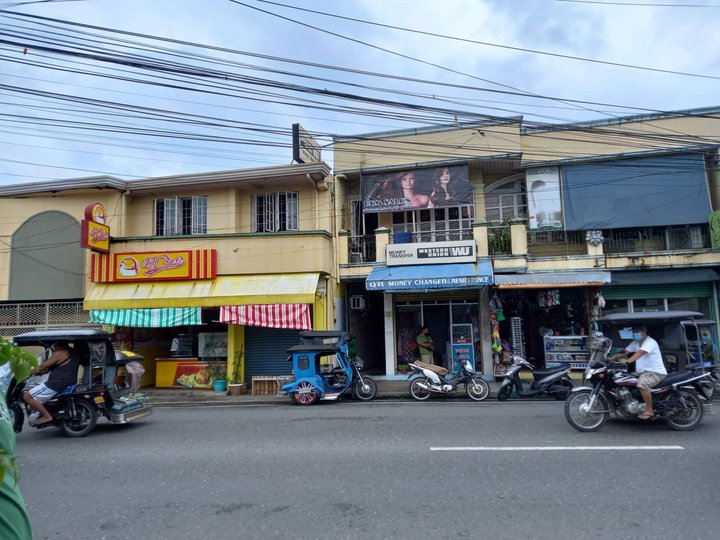 Commercial bldg. And residential house located along national road